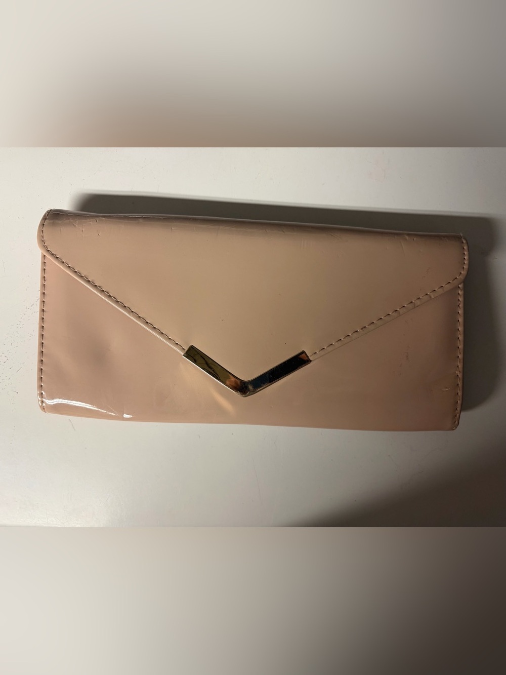 Elegant Nude Patent Clutch with Gold Accent